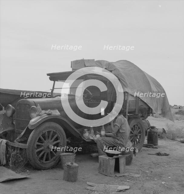 Potato picker in camp near Shafter, California, 1937. Creator: Dorothea Lange.
