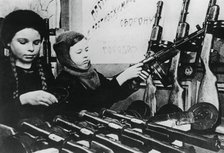 Young girls assembling machine guns in a Russian factory, 1943. Artist: Unknown