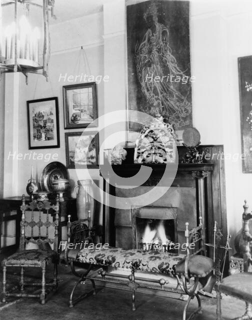 Fireplace, furniture, and works of art in Frances Benjamin Johnston's..., New Orleans, c1920 - 1950. Creator: Frances Benjamin Johnston.