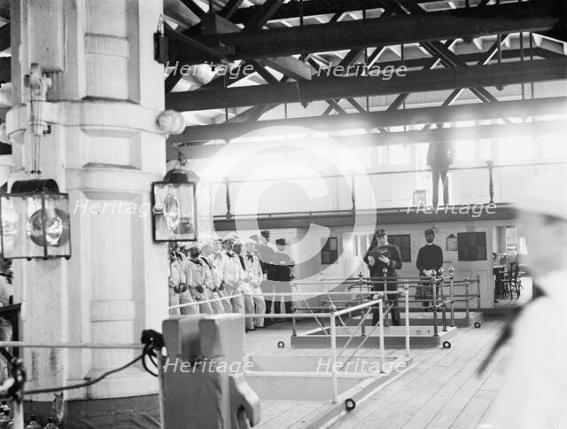 U.S.S. New Hampshire, reading the articles of war, between 1890 and 1901. Creator: William H. Jackson.