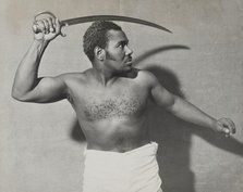Rex Ingram, shirtless, with cutlass, 1938. Creator: Unknown.