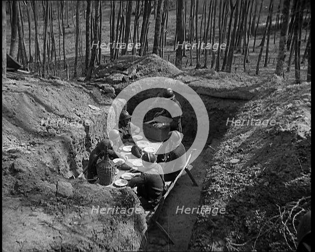 French Soldiers Eating a Meal in a Dug Out, 1940. Creator: British Pathe Ltd.