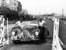 Healey Westland 2.4, Eastbourne Rally 1952, S.P.A. Freeman getting into car. Creator: Unknown.