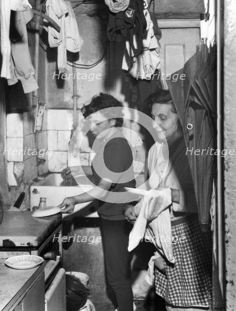 Slum dwelling in London's East End, 1965. Artist: EH Emanuel