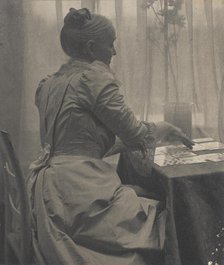 Woman Playing Solitaire, c.1910. Creator: Gertrude Kasebier.