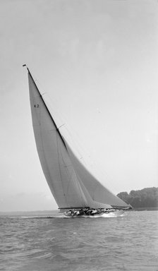 The 23-metre cutter 'Astra' sailing close-hauled, 1931. Creator: Kirk & Sons of Cowes.