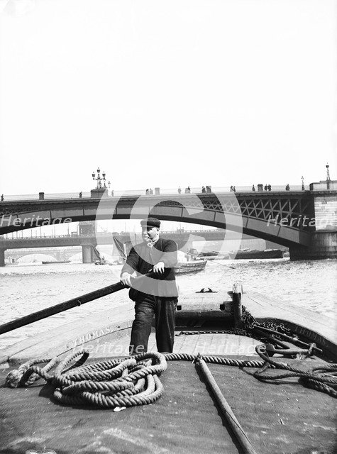 Lighter on the Thames going downstream towards Southwark Bridge, London, c1905. Artist: Unknown