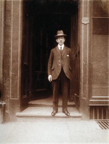 An unidentified man standing in a doorway, 1926. Creator: William Brown.