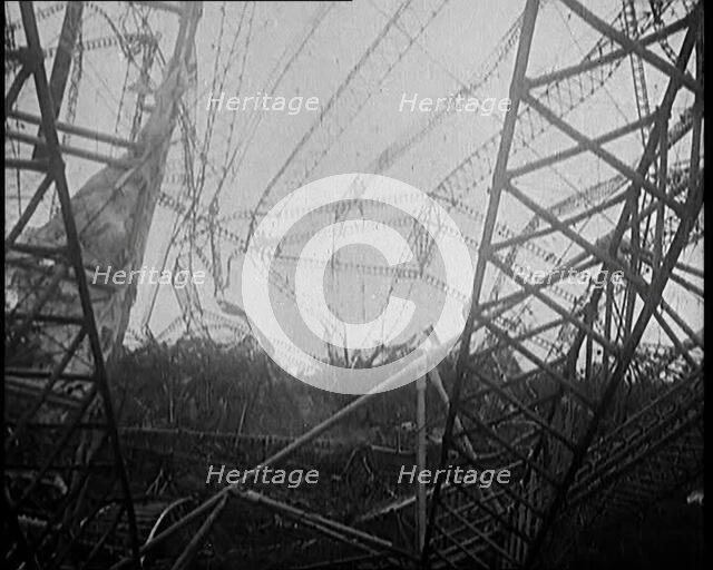 The Burnt Remains of the R-101 Airship Lying on the Ground After Fire and Destruction, 1930. Creator: British Pathe Ltd.