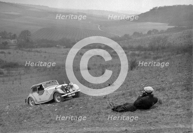 Riley 16 competing in the London Motor Club Coventry Cup Trial, Knatts Hill, Kent, 1938. Artist: Bill Brunell.