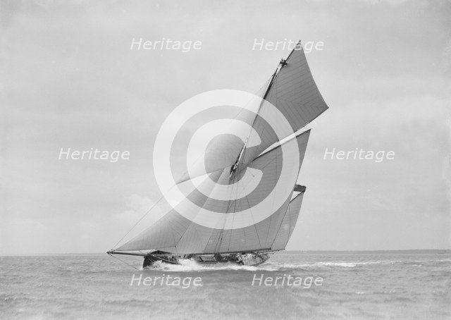 The yawl 'Joyce' sailing in good wind, 1911. Creator: Kirk & Sons of Cowes.