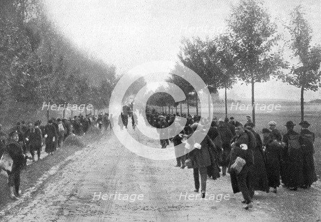 Belgians fleeing from Termonde, First World War, 1914, (1920). Artist: Unknown