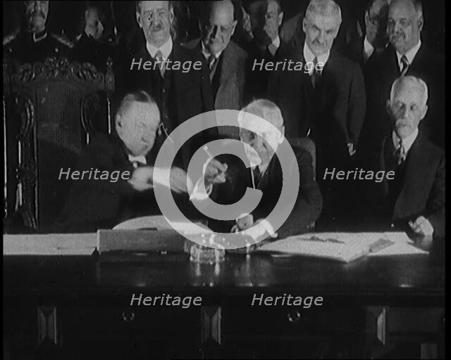 Frank Billings Kellogg Sitting Next to American President Calvin Coolidge Signing the Kellogg...1929 Creator: British Pathe Ltd.