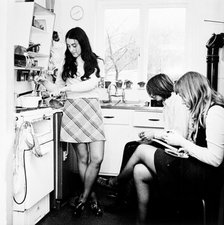 Three young people in the kitchen of a London flat, c1960s. Artist: Henry Grant