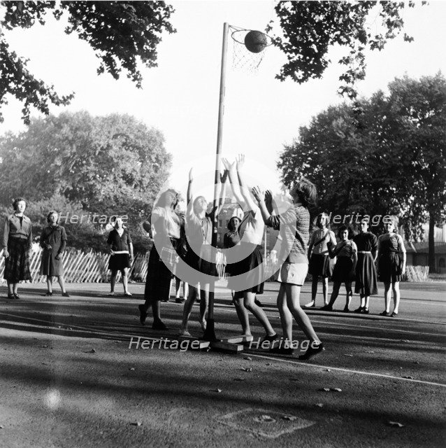 Netball game at Coram's Fields School, Camden, London, 1959. Artist: Henry Grant