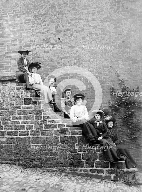 Women sitting on steps of an unidentified building, Hellidon, Northamptonshire, c1896-c1920. Artist: Alfred Newton & Sons.