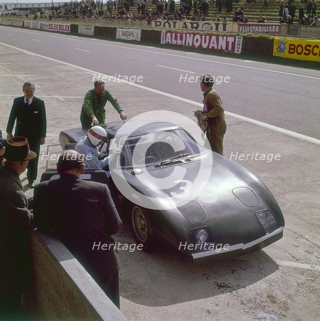 Jackie Stewart getting into a Rover BRM turbine, Le Mans, France, 1965. Artist: Unknown
