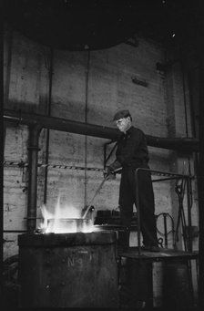 Man working at the Wear Flint Glass Works, Alfred Street, Millfield, Sunderland, 1961. Creator: Eileen Deste.