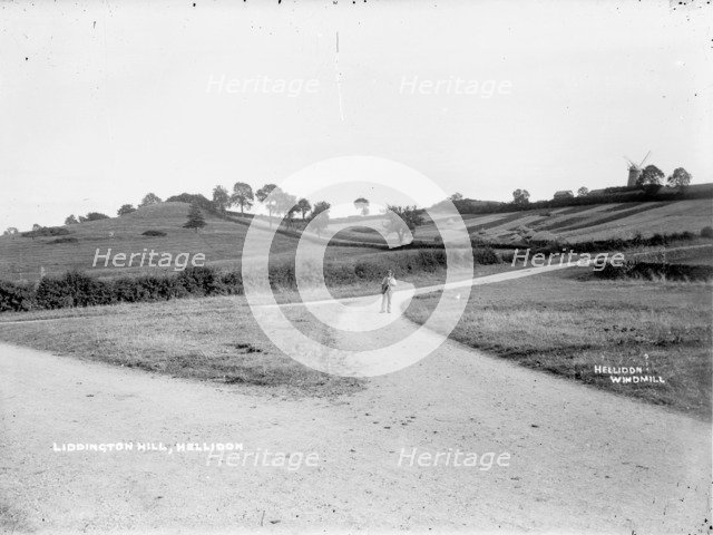 A farm labourer walking to work near Hellidon, Northamptonshire, c1873-c1923. Artist: Alfred Newton & Sons