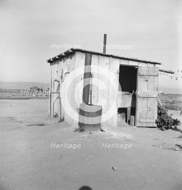 Laundry facilities for ten cabins at Arkansawyers auto camp, Salinas Valley, California, 1939. Creator: Dorothea Lange.
