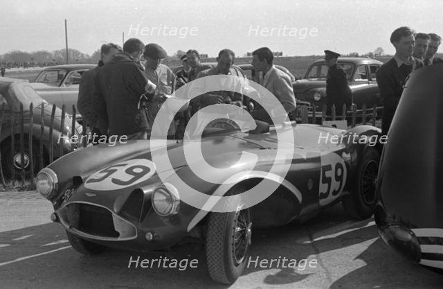 Aston Martin DB3S, Stirling Moss in paddock at Goodwood International Sports Car Race 1956. Creator: Unknown.
