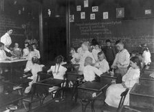 School children conducting simple experiments, Washington, D.C., (1899?). Creator: Frances Benjamin Johnston.