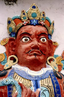 Painted relief of a deity, monastery, Ladakh, India, 1988. Creator: Amanda Waite.