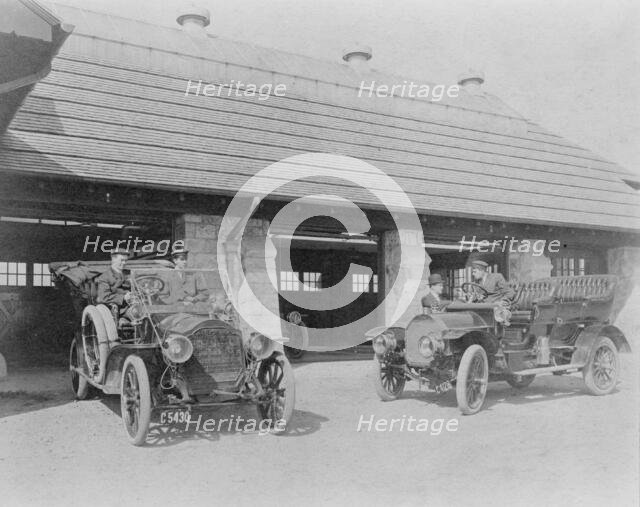 Four men with two automobiles outside of garage of Edmund Cogswell..., Greenwich, Connecticut, 1908. Creator: Frances Benjamin Johnston.