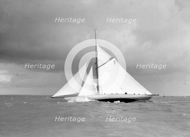 The 15 Metre class sailing yacht 'Istria' close-hauled and heeling in fresh breeze, 1912.  Creator: Kirk & Sons of Cowes.