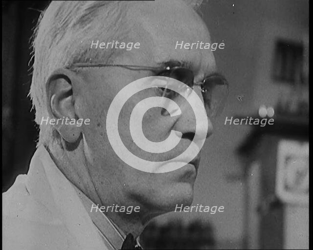 Dr Alexander Fleming, the Inventor of Penicillin, Experimenting in a Laboratory, 1929. Creator: British Pathe Ltd.
