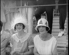 Two Female Civilians at a Horse Race Event Wearing Smart Summer Outfits and Hats, 1920. Creator: British Pathe Ltd.