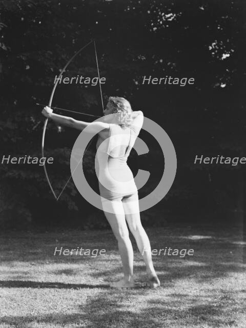 Chase, Diana, Miss, doing archery, 1933 June 22. Creator: Arnold Genthe.