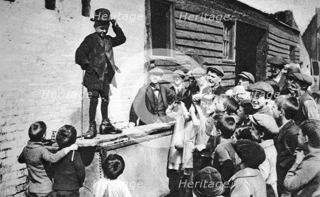 A budding Charlie Chaplin admirer, east end of London, 1926-1927. Artist: Unknown