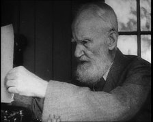 George Bernard Shaw Setting up a Typewriter, 1930s. Creator: British Pathe Ltd.