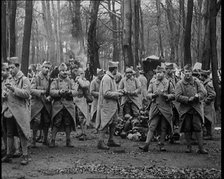 Male French Soldier Stand in a Wood Eating, 1924. Creator: British Pathe Ltd.