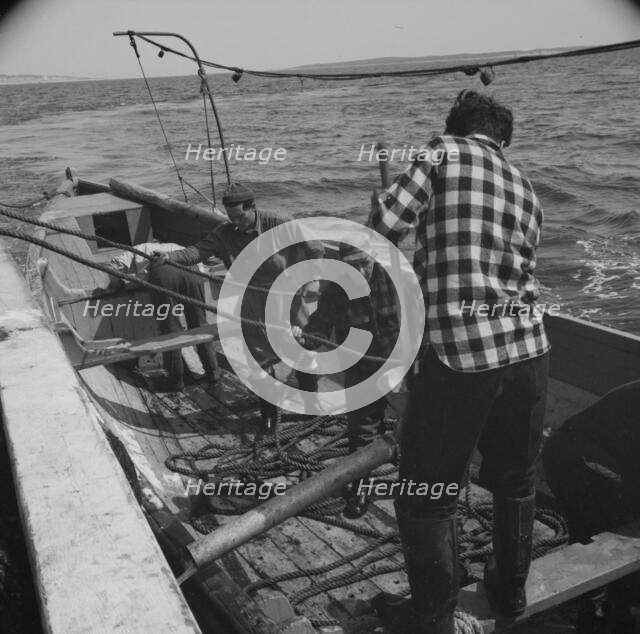 Possibly: On board the fleshing boat Alden, out of Gloucester, Massachusetts, 1943. Creator: Gordon Parks.