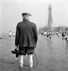An elderly man paddling in the sea, Blackpool, c1946-c1955. Artist: John Gay