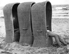 Basket shelters on a beach in Belgium, 1966. 