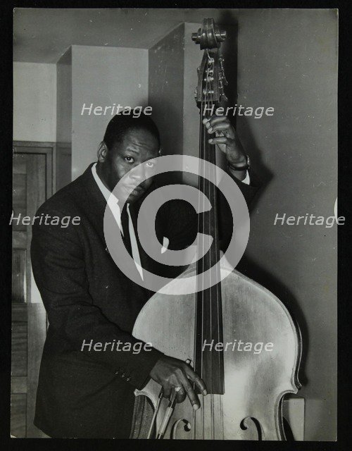 Portrait of American double bass player Curtis Counce, c1950s. Artist: Denis Williams