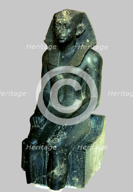 Seated statue of Sesostris III depicted as a young man, made in diorite, comes from Medamout, 187…