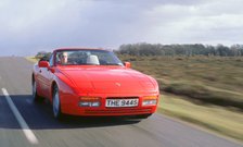 1990 Porsche 944 cabriolet driving along. Artist: Unknown.