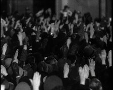 Crowd With Right Arms Raised in a Nazi Salute in the Direction of the..., 1937. Creator: British Pathe Ltd.