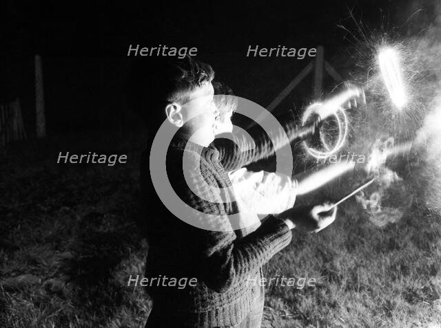 Children with fireworks, c1955. Creator: Arthur Charles Kirby Ware.
