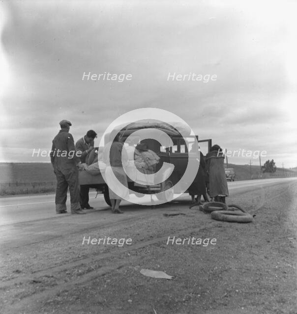 Migrants, family of Mexicans, on road with tire trouble, looking for work..., CA, 1936. Creator: Dorothea Lange.