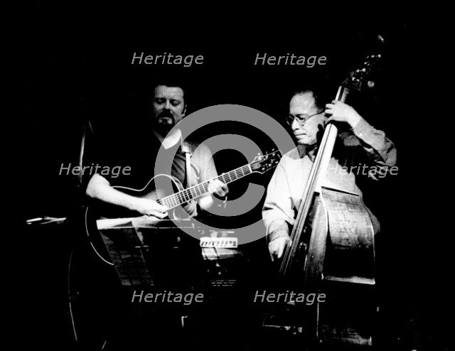 Eddie Gomez and Martin Taylor, Ronnie Scott's, London, July 2000. Artist: Brian O'Connor.
