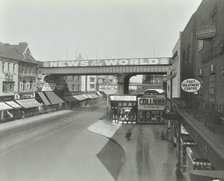 Railway bridge and advertising over the Brixton Road, Lambeth, London, 1938. Artist: Unknown.