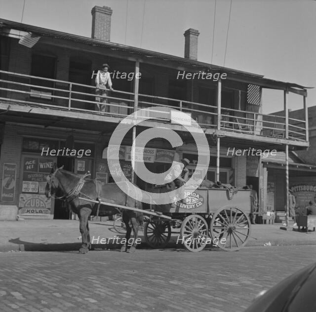 Street scene in the Negro section, Jacksonville, Florida, 1943. Creator: Gordon Parks.