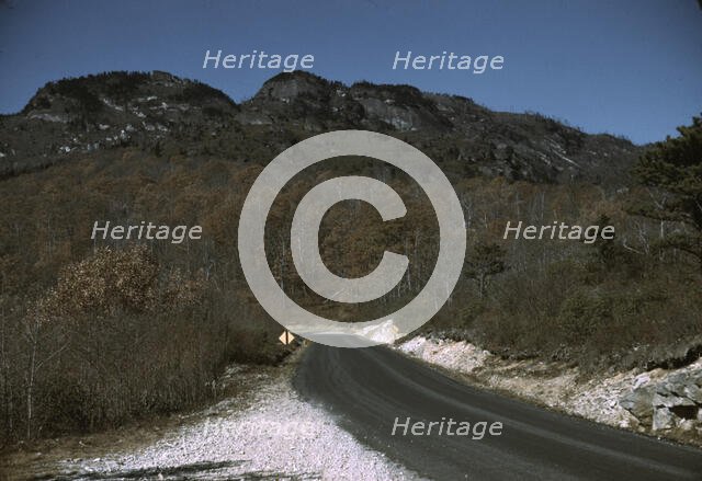 The road along the Skyline Drive, with a light snowfall in the rocks beside, Virginia, ca. 1940. Creator: Jack Delano.