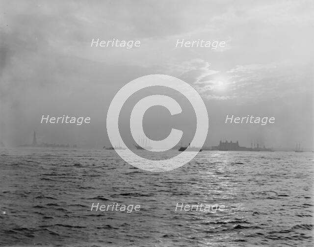 Sunset off the Battery, New York harbor, ca 1900. Creator: Unknown.