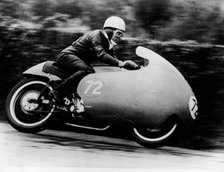 Possibly Bill Lomas, on a Moto Guzzi V8, 1957. Artist: Unknown